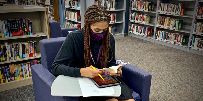 Anisah Wolf '22 is hard at work in the library during the first week of school.