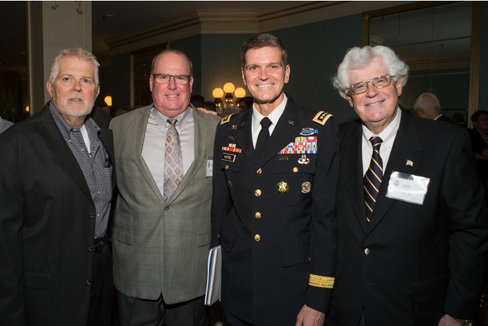 Gen. Votel (second from right) is joined by attendees at the Community Awards Dinner.