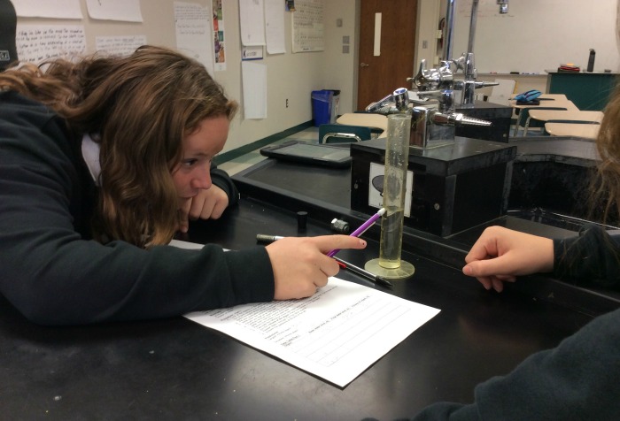 Emily McQuillan tries to identify a liquid, by measuring its volume and calculating its density.